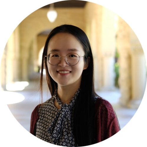 Headshot of Chinese woman with long black hair wearing eyeglasses and a blue and white patterned blouse.